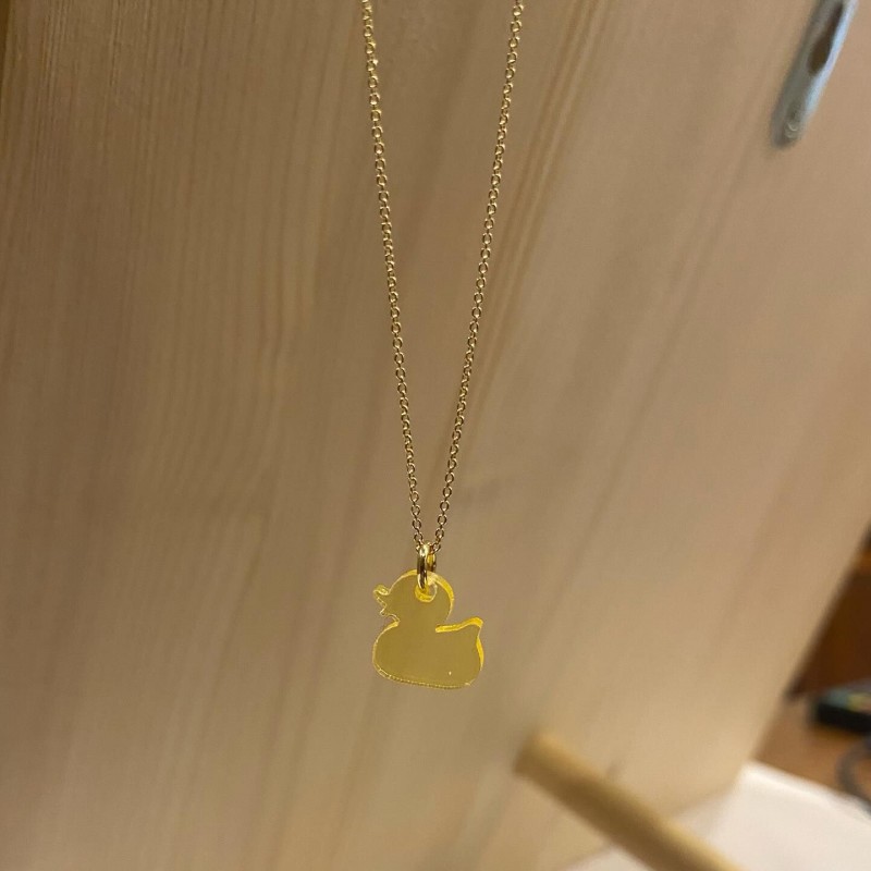 Collier (or) et pendentif en plexiglas - Canard Collier (or) et pendentif en plexiglas - Canard